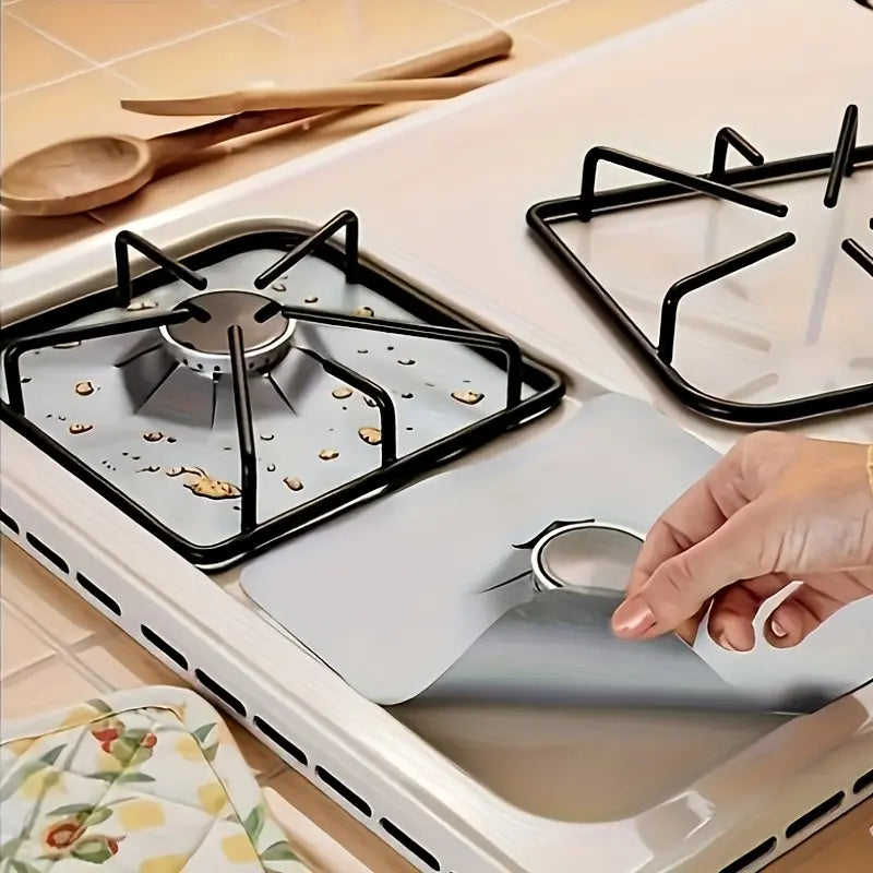 Gas stove liner catching cooking splatters